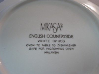   Four rimmed soup bowls in the English Countryside pattern by Mikasa